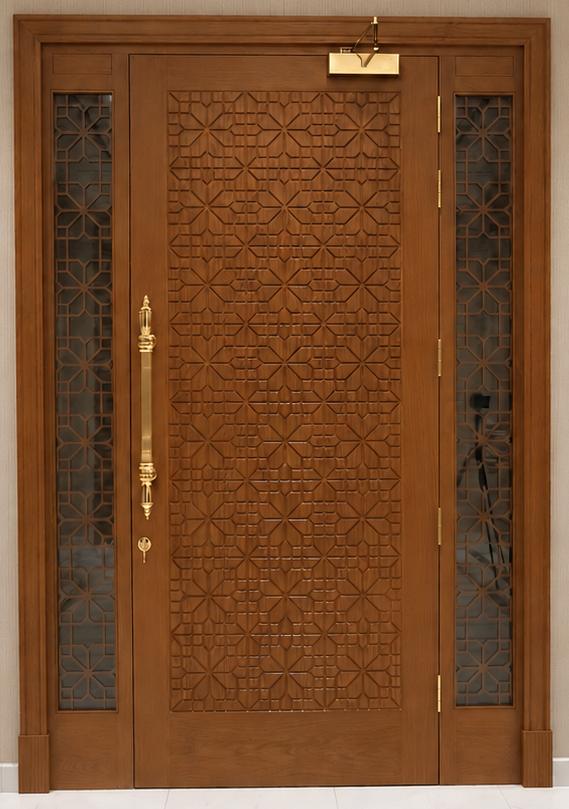 Decorative carved wooden entrance door with brass hardware and patterned side screens