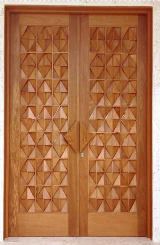 Decorative carved wooden double door with geometric relief